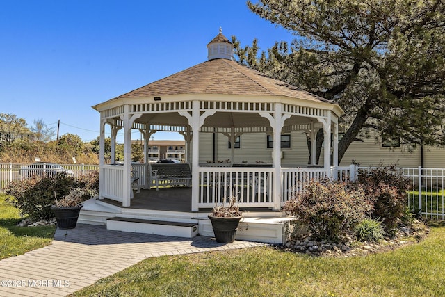 exterior space featuring a gazebo and fence