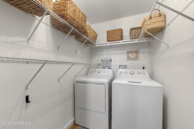laundry area featuring laundry area and independent washer and dryer