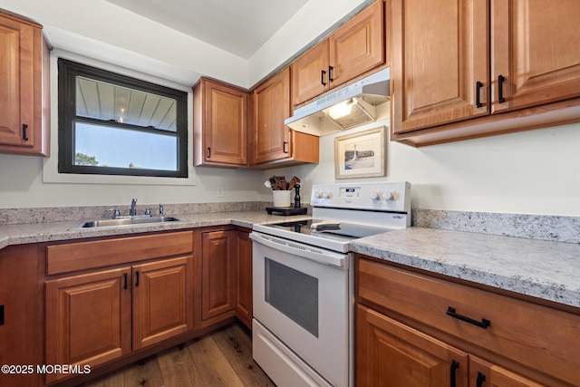 kitchen with white electric range, brown cabinets, a sink, dark wood-style floors, and under cabinet range hood