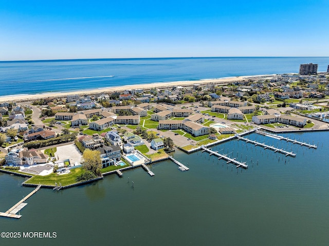 bird's eye view with a water view and a residential view