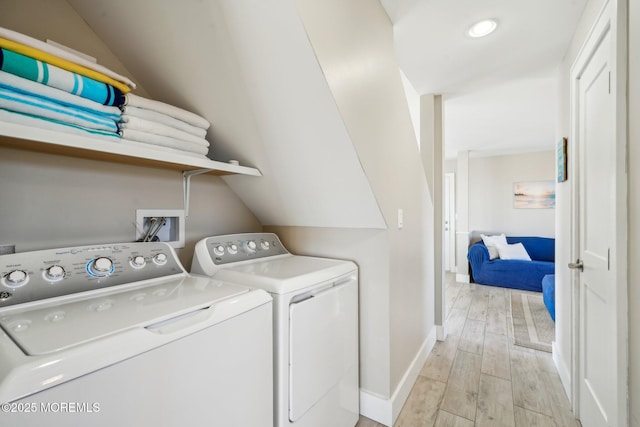 washroom with laundry area, washing machine and dryer, baseboards, recessed lighting, and light wood-style flooring