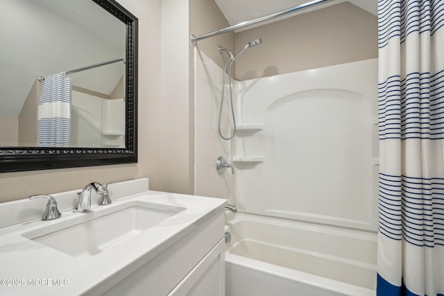 full bath featuring vanity, lofted ceiling, and shower / tub combo