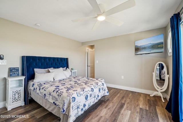 bedroom with baseboards, a ceiling fan, and wood finished floors