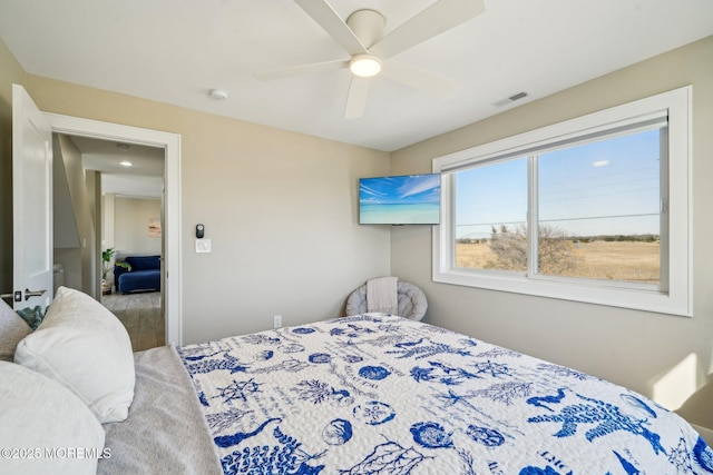 bedroom featuring ceiling fan and visible vents