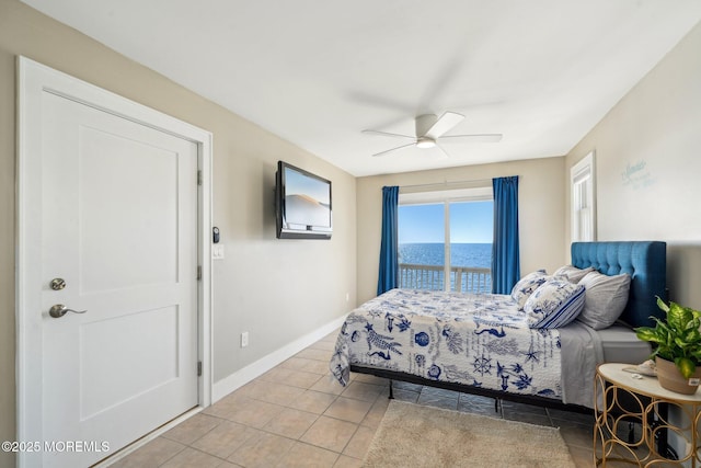 bedroom featuring light tile patterned flooring, baseboards, and a ceiling fan