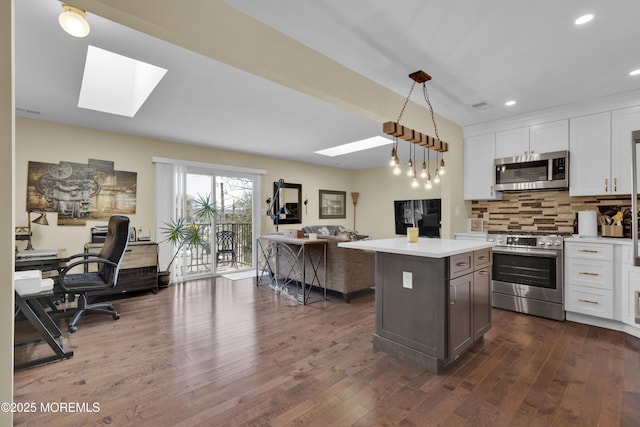 1606 Main St Unit R305, Belmar, NJ 07719 - kitchen featuring open floor plan, dark wood-style floors, light countertops, a skylight, and stainless steel appliances