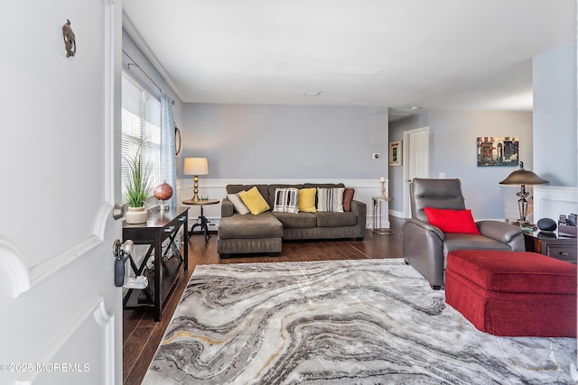living room featuring wainscoting and wood finished floors