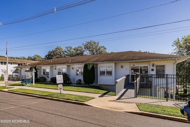 ranch-style home with fence