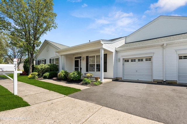 27 Greylawn Dr, Lakewood, NJ 08701 - ranch-style house featuring a garage, covered porch, driveway, and roof with shingles