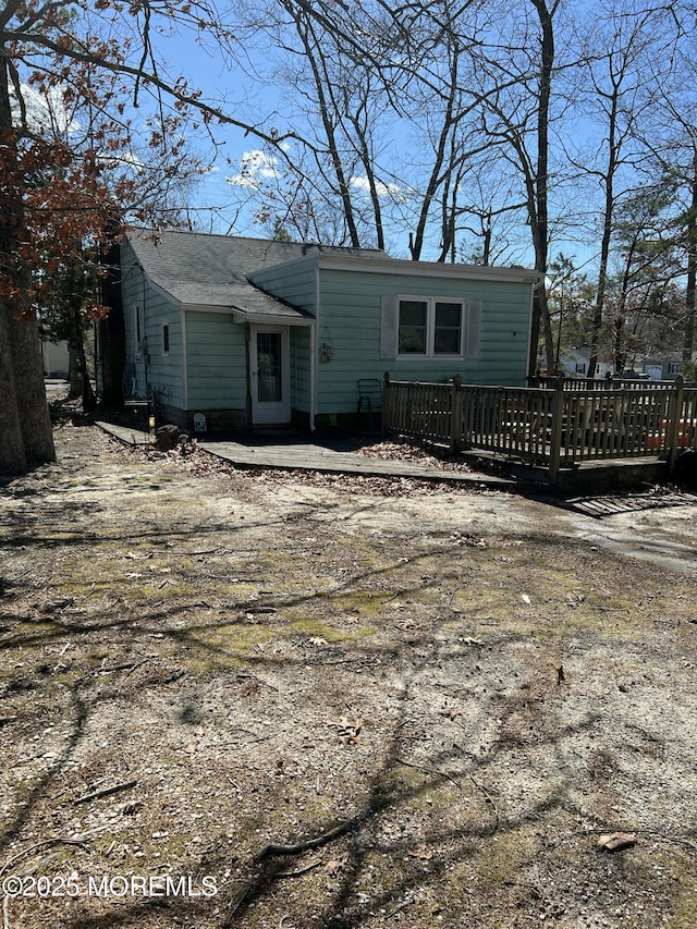 rear view of property with a deck