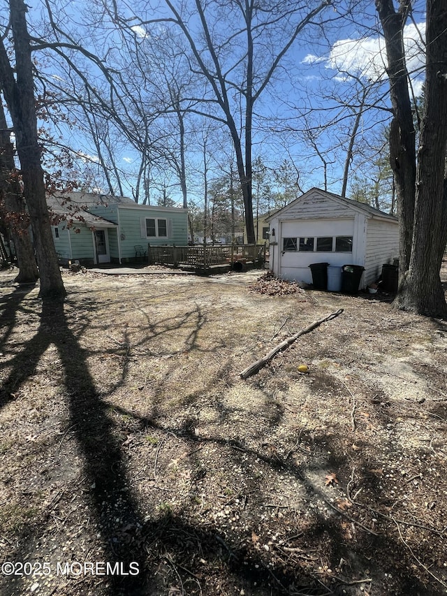 exterior space with a garage and a deck