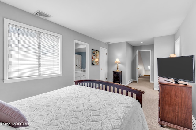bedroom with visible vents, multiple windows, baseboard heating, and light carpet