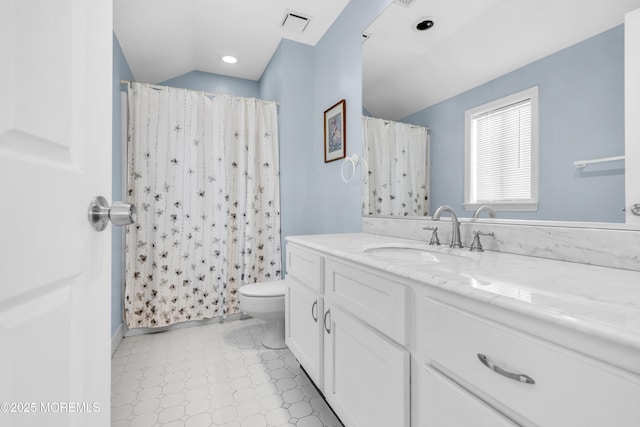 bathroom featuring visible vents, curtained shower, vanity, tile patterned floors, and toilet