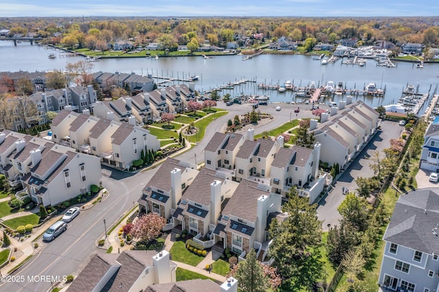 aerial view with a water view and a residential view