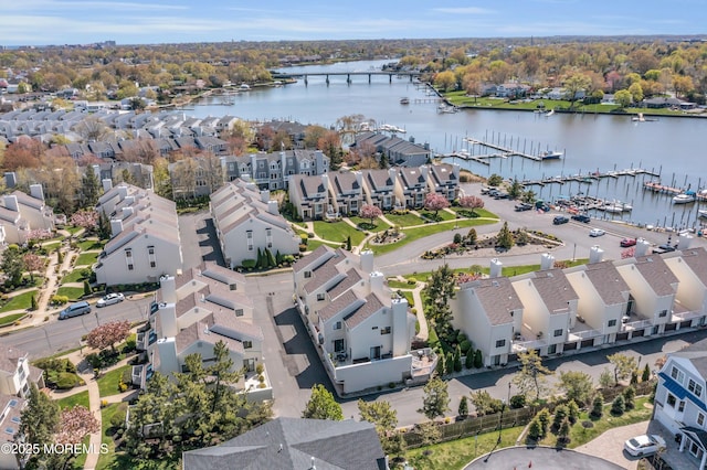 aerial view with a residential view and a water view