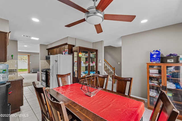dining space featuring visible vents, stairs, light tile patterned flooring, ceiling fan, and recessed lighting