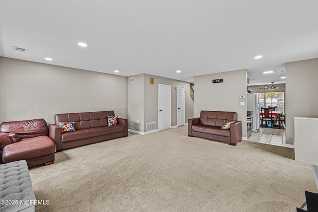 living area with carpet flooring, recessed lighting, and visible vents