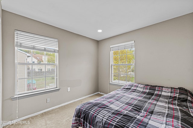 bedroom featuring recessed lighting, baseboards, and carpet