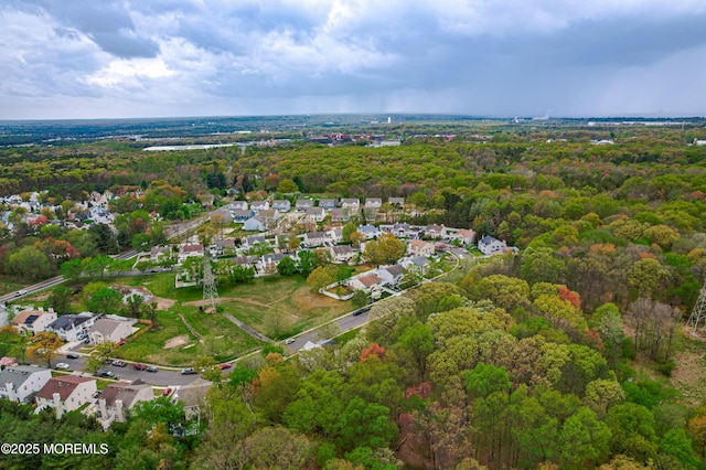 bird's eye view featuring a view of trees and a residential view