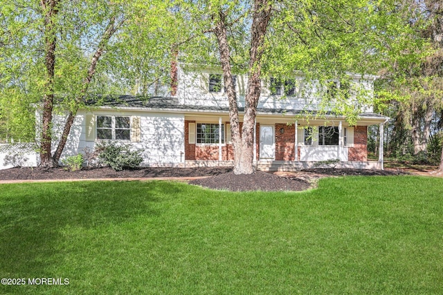 2338 Ramshorn Dr, Allenwood, NJ 08720 - view of front of property featuring a porch, brick siding, and a front yard