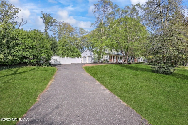 2338 Ramshorn Dr, Allenwood, NJ 08720 - view of front of property with fence, a garage, driveway, and a front yard