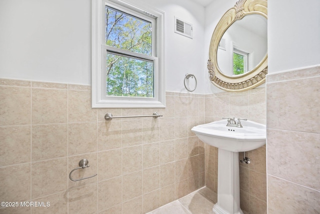 2338 Ramshorn Dr, Allenwood, NJ 08720 - bathroom with wainscoting, tile walls, plenty of natural light, and visible vents