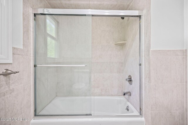 2338 Ramshorn Dr, Allenwood, NJ 08720 - bathroom with tile walls and combined bath / shower with glass door