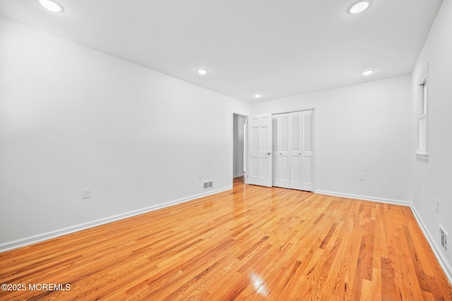 2338 Ramshorn Dr, Allenwood, NJ 08720 - unfurnished bedroom with light wood finished floors, recessed lighting, baseboards, visible vents, and a closet