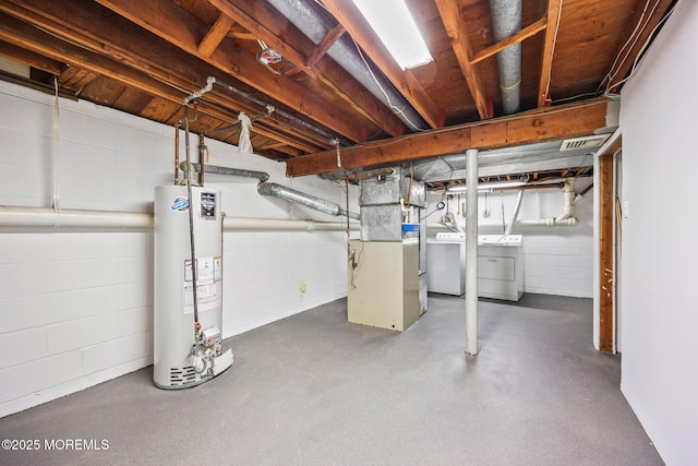 2338 Ramshorn Dr, Allenwood, NJ 08720 - unfinished basement with gas water heater, visible vents, washing machine and clothes dryer, concrete block wall, and heating unit