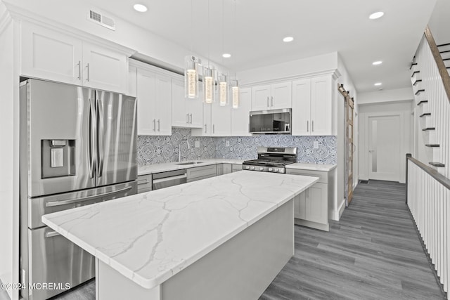 1501 Central, Seaside Heights, NJ 08751 - kitchen featuring appliances with stainless steel finishes, white cabinetry, recessed lighting, backsplash, and light stone counters