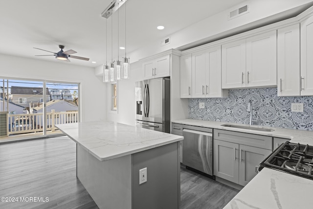1501 Central, Seaside Heights, NJ 08751 - kitchen featuring stainless steel appliances, a sink, a kitchen island, dark wood-style flooring, and ceiling fan