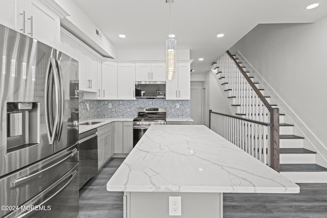 1501 Central, Seaside Heights, NJ 08751 - kitchen featuring stainless steel appliances, a sink, a center island, dark wood finished floors, and decorative backsplash
