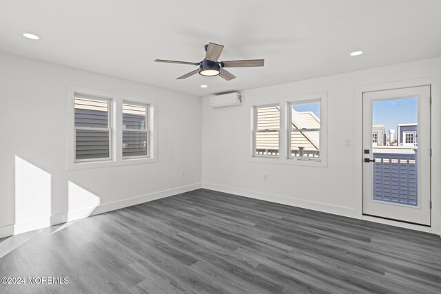 1501 Central, Seaside Heights, NJ 08751 - unfurnished room featuring healthy amount of natural light, dark wood finished floors, a wall unit AC, recessed lighting, and ceiling fan