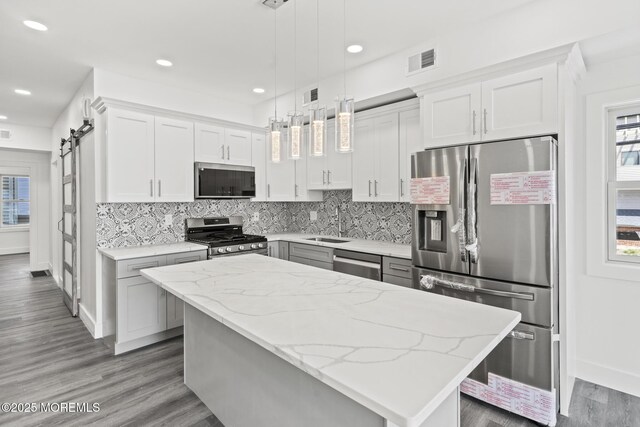1501 Central, Seaside Heights, NJ 08751 - kitchen with stainless steel appliances, a sink, decorative backsplash, light stone countertops, and recessed lighting