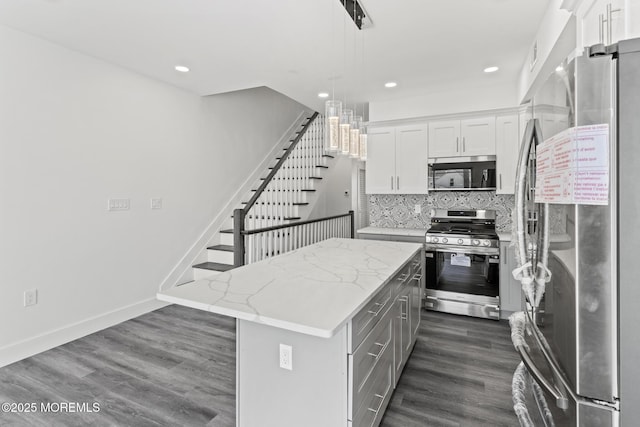 1501 Central, Seaside Heights, NJ 08751 - kitchen with stainless steel appliances, dark wood-style floors, a kitchen island, decorative backsplash, and white cabinets