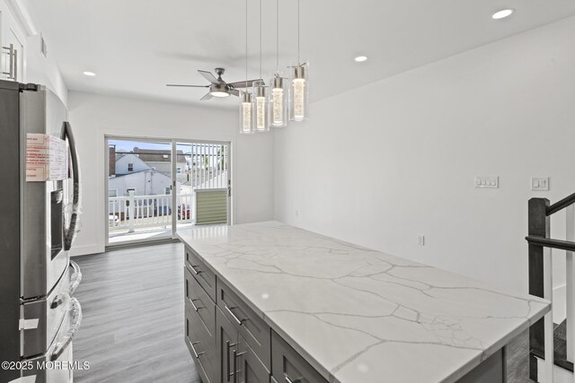 1501 Central, Seaside Heights, NJ 08751 - kitchen with stainless steel fridge with ice dispenser, ceiling fan, recessed lighting, light wood-type flooring, and light stone countertops