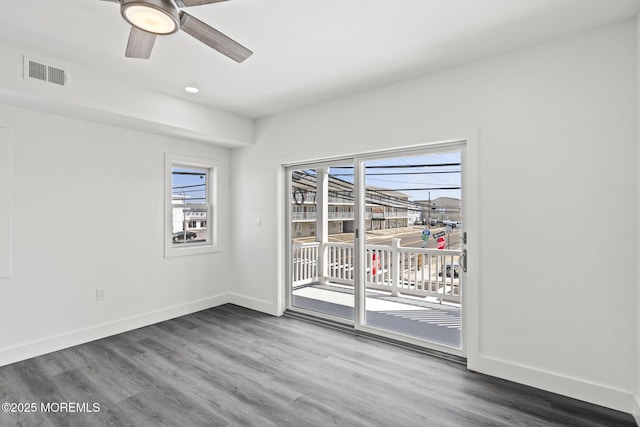 1501 Central, Seaside Heights, NJ 08751 - empty room with plenty of natural light, wood finished floors, baseboards, ceiling fan, and recessed lighting