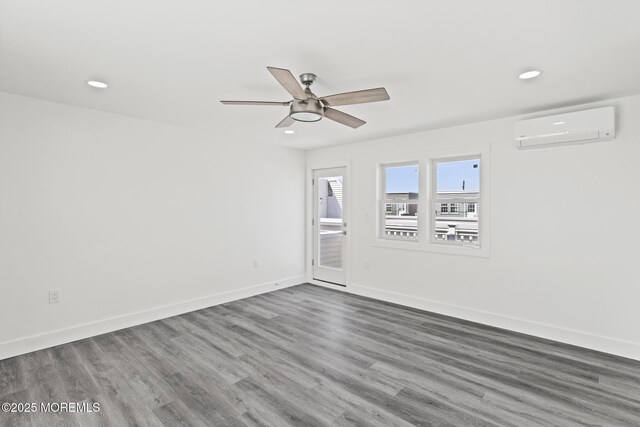 1501 Central, Seaside Heights, NJ 08751 - unfurnished room with a wall mounted air conditioner, recessed lighting, wood finished floors, a ceiling fan, and baseboards