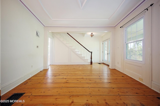 foyer featuring stairs and light wood finished floors