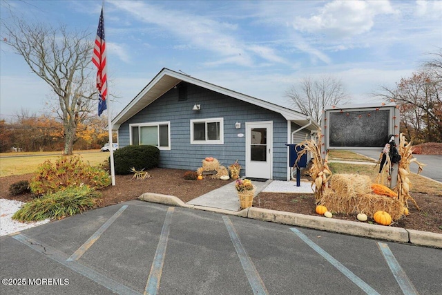 bungalow featuring uncovered parking