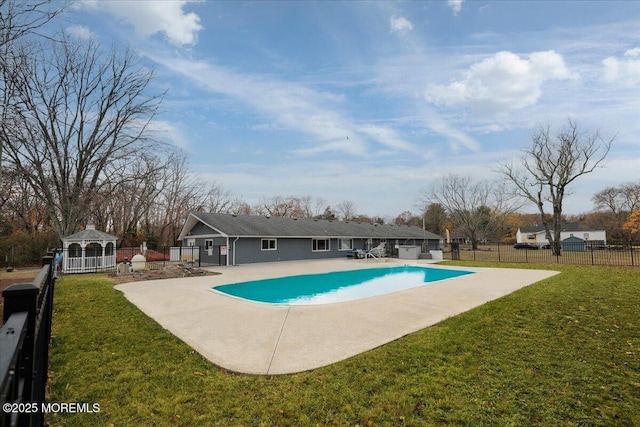 community pool with a gazebo, a patio area, fence, and a yard