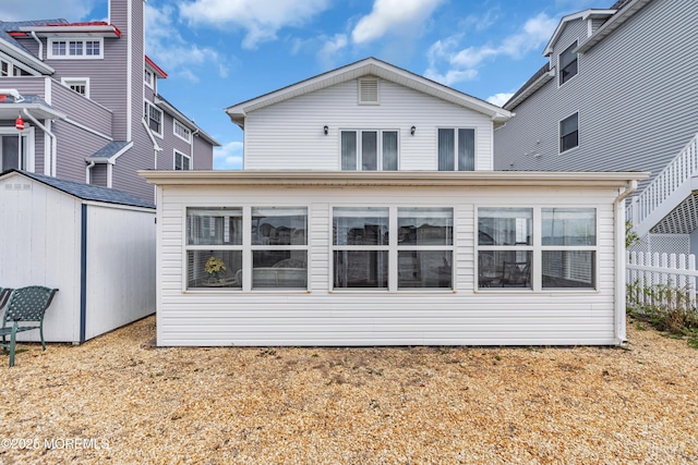 254 Butler Blvd, Bayville, NJ 08721 - back of property with fence, an outbuilding, and a shed