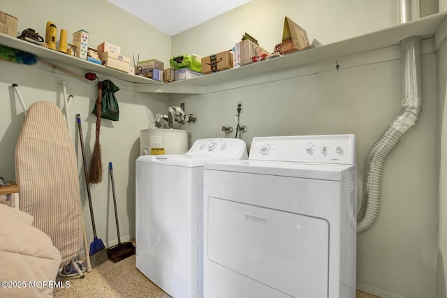 washroom with laundry area, independent washer and dryer, and electric water heater