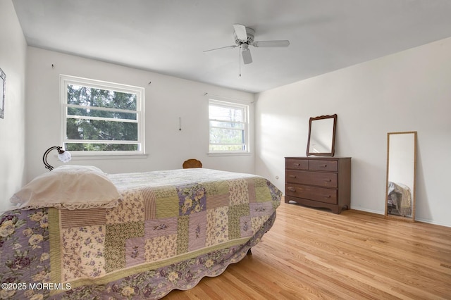 bedroom with a ceiling fan and wood finished floors
