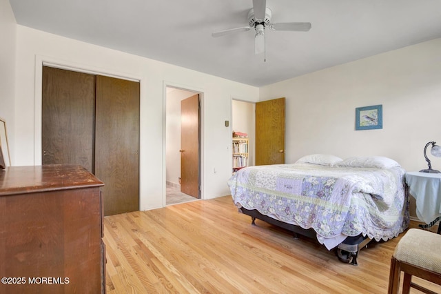bedroom with a ceiling fan and light wood-style flooring