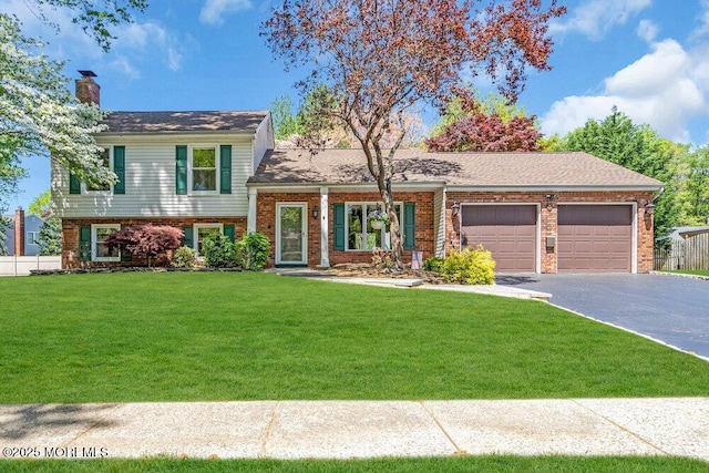 5 Beth Dr, Middletown, NJ 07748 - split level home with a garage, a front yard, driveway, and a chimney