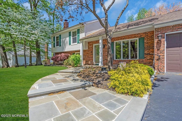 5 Beth Dr, Middletown, NJ 07748 - view of front of home featuring brick siding, a front lawn, and a chimney