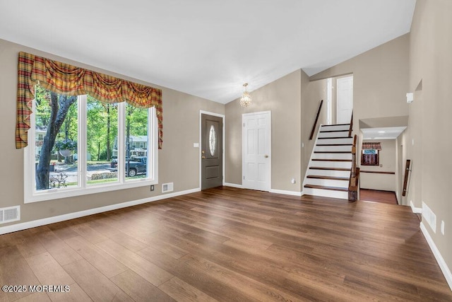 5 Beth Dr, Middletown, NJ 07748 - foyer with visible vents, wood finished floors, stairway, baseboards, and a chandelier