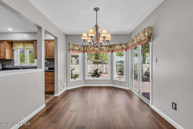 5 Beth Dr, Middletown, NJ 07748 - unfurnished dining area with visible vents, an inviting chandelier, baseboards, dark wood-type flooring, and a sink