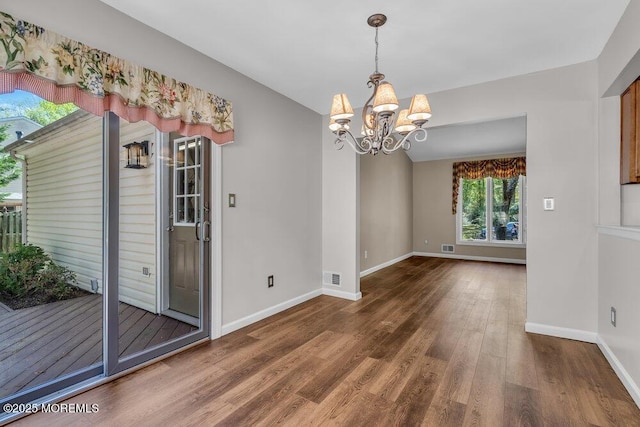 5 Beth Dr, Middletown, NJ 07748 - unfurnished dining area with baseboards, wood finished floors, a chandelier, and visible vents